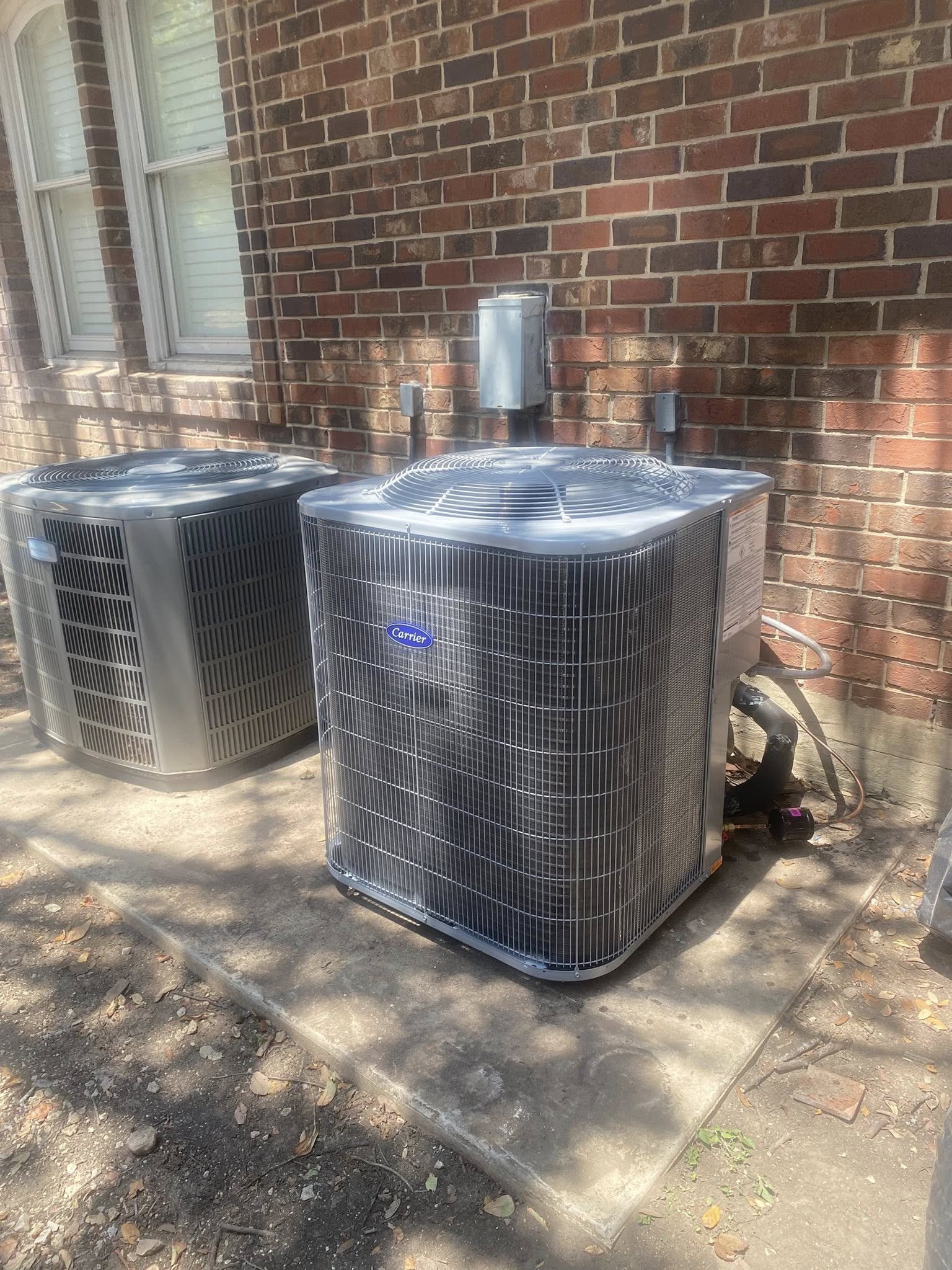 Texas Air Solutions Carrier AC condensers installed at a San Antonio home